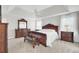 Main bedroom with dark wood furniture and carpeted floors at 5225 Mulholland Dr, Summerville, SC 29485
