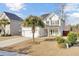 Two-story house with beige siding, attached garage, and landscaped yard at 5225 Mulholland Dr, Summerville, SC 29485