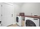 Laundry room with washer, dryer, and built-in shelving at 5225 Mulholland Dr, Summerville, SC 29485