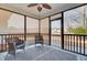 Relaxing screened porch with wicker chairs and rug, offering backyard views at 5225 Mulholland Dr, Summerville, SC 29485