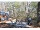 Private backyard patio with wooded surroundings at 6321 Bears Bluff Rd, Wadmalaw Island, SC 29487
