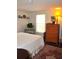 Bedroom with queen bed, wood furniture, and rug at 6321 Bears Bluff Rd, Wadmalaw Island, SC 29487
