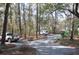 Gravel driveway leading to the property, surrounded by trees at 6321 Bears Bluff Rd, Wadmalaw Island, SC 29487