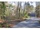 Gravel driveway leading to a mobile home in the woods at 6321 Bears Bluff Rd, Wadmalaw Island, SC 29487