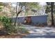 Gray mobile home with red door, nestled in wooded lot at 6321 Bears Bluff Rd, Wadmalaw Island, SC 29487