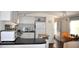 Modern kitchen with white cabinets and breakfast bar at 6321 Bears Bluff Rd, Wadmalaw Island, SC 29487