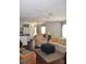 Open living room with hardwood floors and ceiling fan at 6321 Bears Bluff Rd, Wadmalaw Island, SC 29487