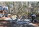 Private patio with table, chairs, and grill at 6321 Bears Bluff Rd, Wadmalaw Island, SC 29487