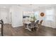 Bright dining room features a farmhouse style table and gray chairs at 705 Squire Pope Rd, Summerville, SC 29486