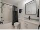 Clean bathroom with a shower/tub combo and white vanity at 7311 Indigo Palms Way, Johns Island, SC 29455
