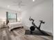 Spacious bedroom with a Peloton bike and large windows at 7311 Indigo Palms Way, Johns Island, SC 29455