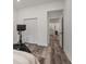 Bright bedroom with Peloton bike and access to hallway at 7311 Indigo Palms Way, Johns Island, SC 29455