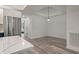 Simple dining area with hardwood floors and a single light fixture at 7311 Indigo Palms Way, Johns Island, SC 29455