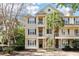 Three-story building with multiple units, balconies, and palm trees at 7311 Indigo Palms Way, Johns Island, SC 29455