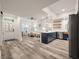 Open concept kitchen boasts modern appliances and a navy blue island at 7311 Indigo Palms Way, Johns Island, SC 29455