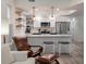 Modern kitchen with white cabinets, marble countertops, and stainless steel appliances at 7311 Indigo Palms Way, Johns Island, SC 29455
