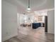 Open concept kitchen and living area with blue cabinets and hardwood floors at 7311 Indigo Palms Way, Johns Island, SC 29455