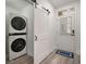 Convenient laundry room with stacked washer and dryer at 7311 Indigo Palms Way, Johns Island, SC 29455