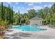 Community pool with surrounding lounge chairs and cabanas at 7311 Indigo Palms Way, Johns Island, SC 29455