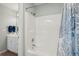 Bathroom with tub and shower, and blue and white decor at 804 E Ashley Ave, Folly Beach, SC 29439