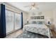 Bedroom with king-size bed, blue decor, and access to a balcony at 804 E Ashley Ave, Folly Beach, SC 29439