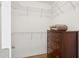 Walk-in closet with wire shelving and a wooden dresser at 804 E Ashley Ave, Folly Beach, SC 29439