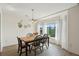 Bright dining area with bay window and wooden table at 804 E Ashley Ave, Folly Beach, SC 29439