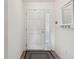 Simple entryway with white door and small rug at 804 E Ashley Ave, Folly Beach, SC 29439