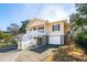 Two-story beach home with side entry, elevated deck, and double garage at 804 E Ashley Ave, Folly Beach, SC 29439