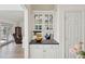 Built-in kitchen cabinetry with glass doors and dark countertop at 804 E Ashley Ave, Folly Beach, SC 29439