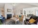 Open living room and kitchen with vaulted ceiling and fireplace at 804 E Ashley Ave, Folly Beach, SC 29439