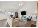 Spacious living room with vaulted ceiling, fireplace, and ample seating at 804 E Ashley Ave, Folly Beach, SC 29439