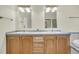 Double vanity bathroom with wood cabinets and gray countertop at 8978 Victor Lincoln Rd, McClellanville, SC 29458