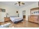 Bright bedroom with wood floors and built-in dresser at 8978 Victor Lincoln Rd, McClellanville, SC 29458