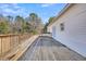 Spacious wooden deck overlooks a wooded area at 8978 Victor Lincoln Rd, McClellanville, SC 29458