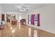 Spacious dining area with hardwood floors and kitchen access at 8978 Victor Lincoln Rd, McClellanville, SC 29458