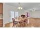 Dining room with hardwood floors and a wooden table at 8978 Victor Lincoln Rd, McClellanville, SC 29458