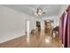 Open dining room and kitchen with hardwood floors at 8978 Victor Lincoln Rd, McClellanville, SC 29458