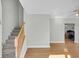 Bright entryway with hardwood floors and staircase at 8978 Victor Lincoln Rd, McClellanville, SC 29458