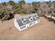 White house with gray roof, viewed from above at 8978 Victor Lincoln Rd, McClellanville, SC 29458