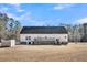 House exterior showcasing back deck and yard at 8978 Victor Lincoln Rd, McClellanville, SC 29458