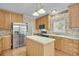 Kitchen boasts stainless steel appliances and wood cabinets at 8978 Victor Lincoln Rd, McClellanville, SC 29458
