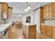 Open kitchen with island and stainless steel appliances at 8978 Victor Lincoln Rd, McClellanville, SC 29458
