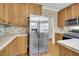 Stainless steel appliances accent the wood cabinets at 8978 Victor Lincoln Rd, McClellanville, SC 29458