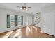 Spacious living room with hardwood floors and ceiling fan at 8978 Victor Lincoln Rd, McClellanville, SC 29458