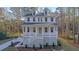 Charming two-story home with white siding, dormer windows, and inviting front porch at 0 United Dr, Huger, SC 29450