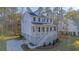 Exterior view of elevated home featuring a covered porch, driveway, garage, and well landscaped yard at 0 United Dr, Huger, SC 29450