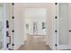 View of the foyer featuring a glass door and sidelights, modern finishes, and a view of the living area at 0 United Dr, Huger, SC 29450