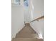 Stairway featuring white walls, a wooden handrail, and light wood steps at 0 United Dr, Huger, SC 29450