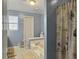 Bathroom with a bathtub and shower, and light blue walls at 1001 Shinnecock Hills Ct, Summerville, SC 29483